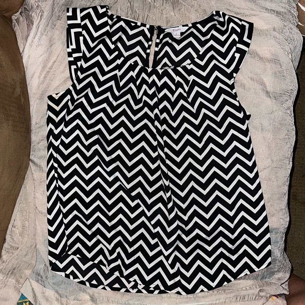 Women’s Candie’s sleeveless black and white blouse, size Large